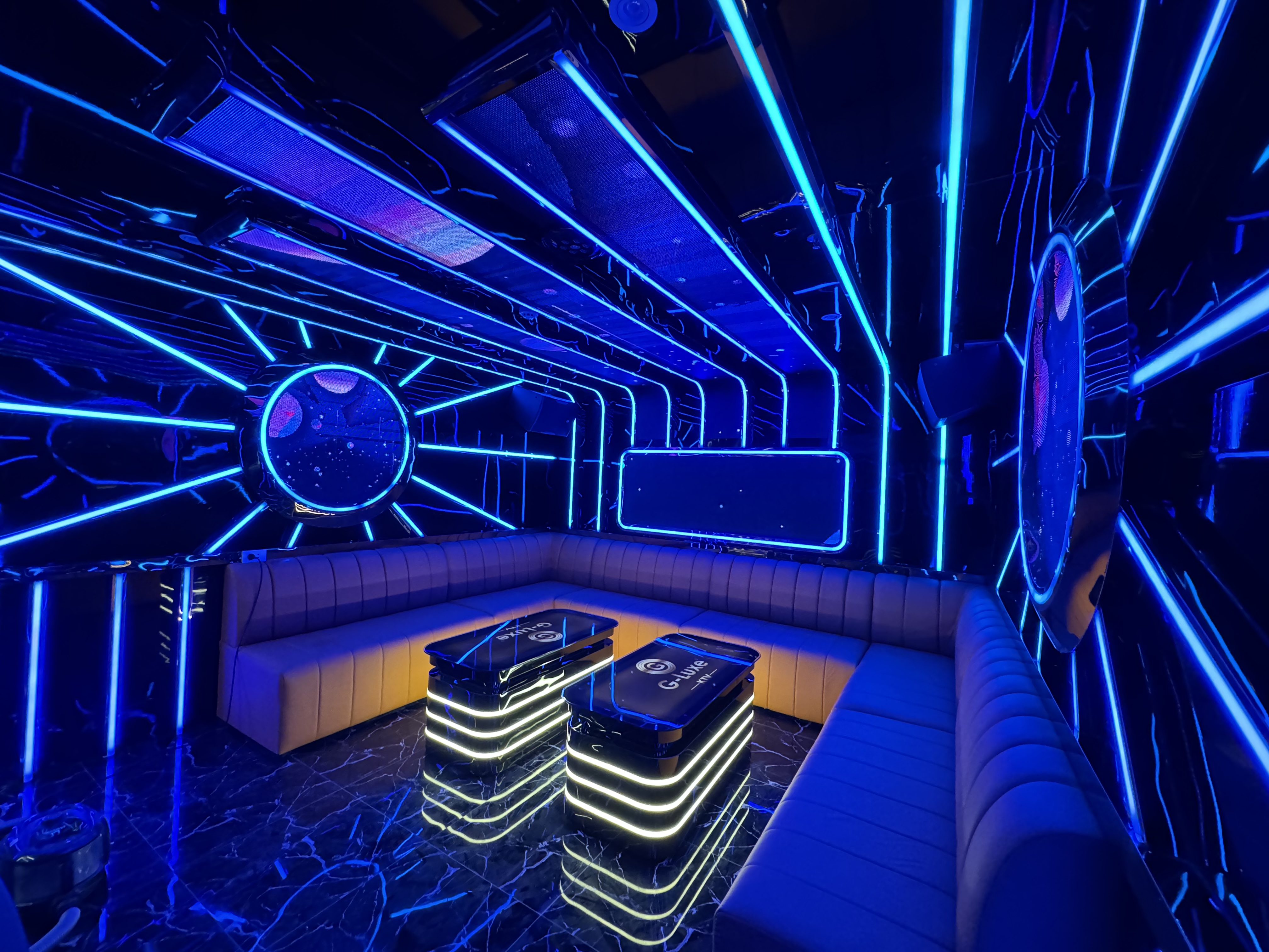 Background grass field with trees, cloudy blue sky. Combination of pastoral scenery, sun, and dark clouds. The purple show...